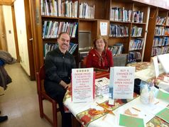 Jim and Liz work the raffle table.