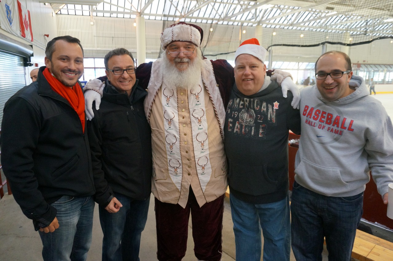 State Rep. Aaron Michlewitz, City Councilor Sal LaMattina, Michael Magner and Matt Bamonte pose for a photo with Santa!